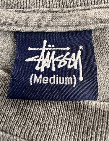 Front tag - Stussy x NEXUS7 Multiple Technix Skull